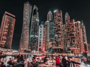 people in front of brown high rise building during nighttime